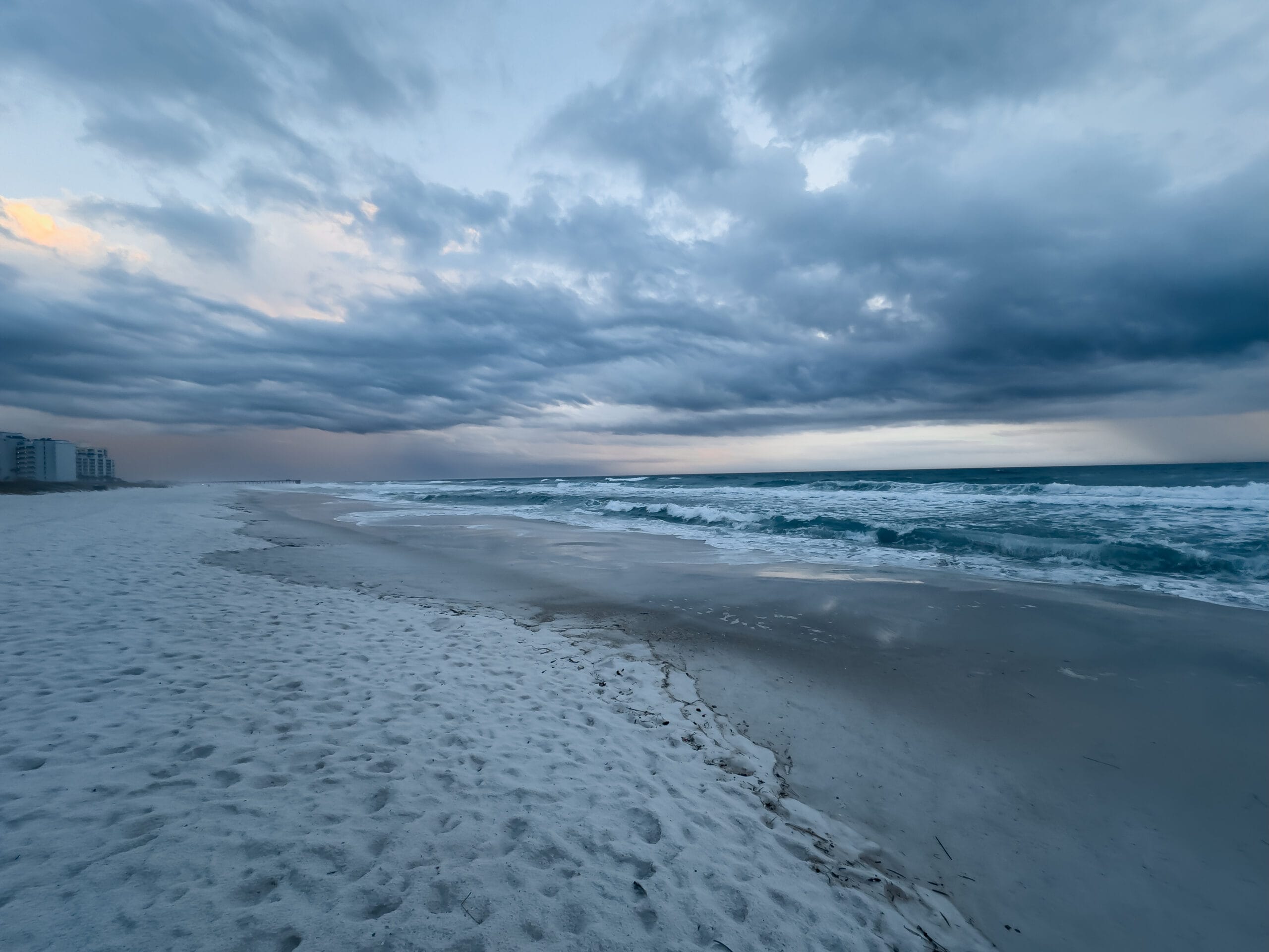 Stormy ocean view photography with dramatic clouds and shoreline